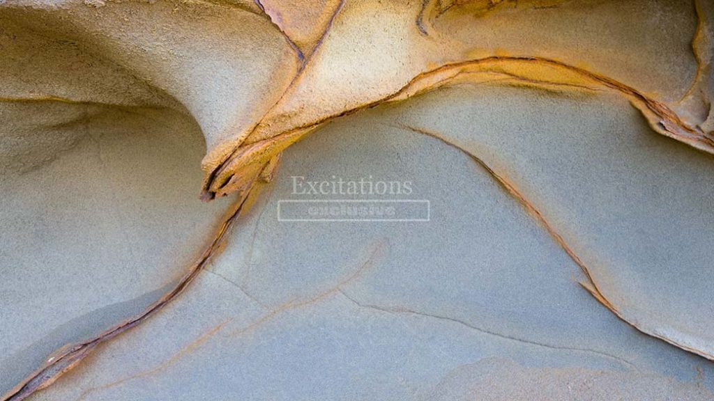 Stock photo backgrounds of beautiful weathered artistic photo of softly coloured weather worn rocks.
